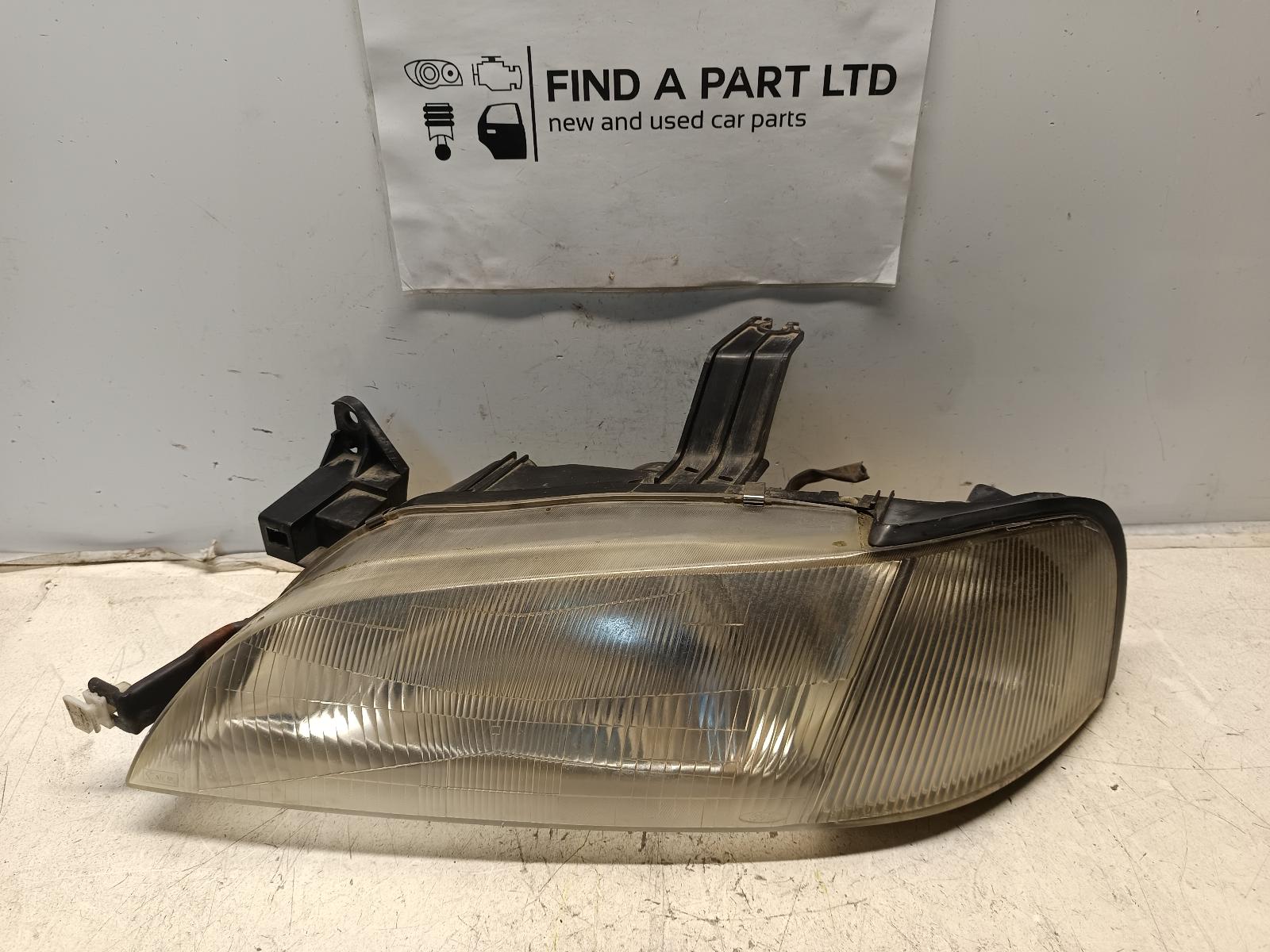 View Auto part Left Headlamp FORD LASER 1996