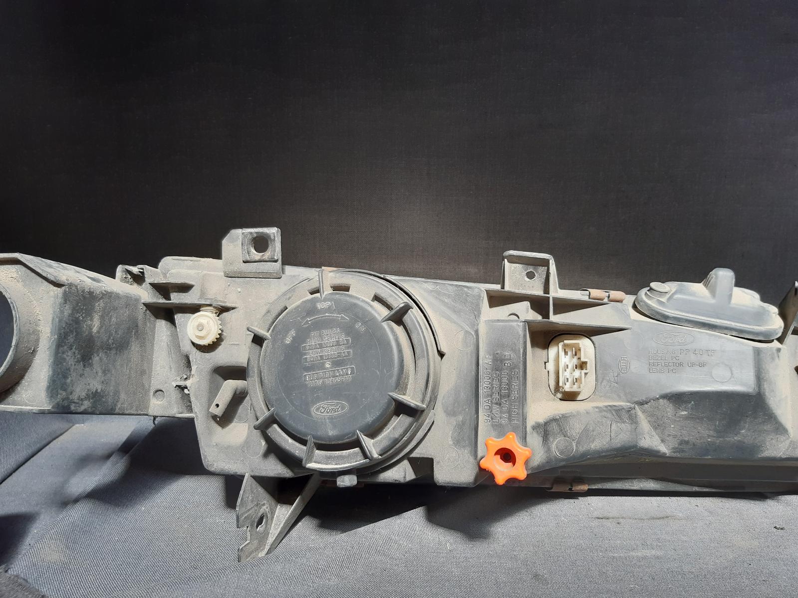 1995 FORD FALCON Left Headlamp Contact us for Photo
