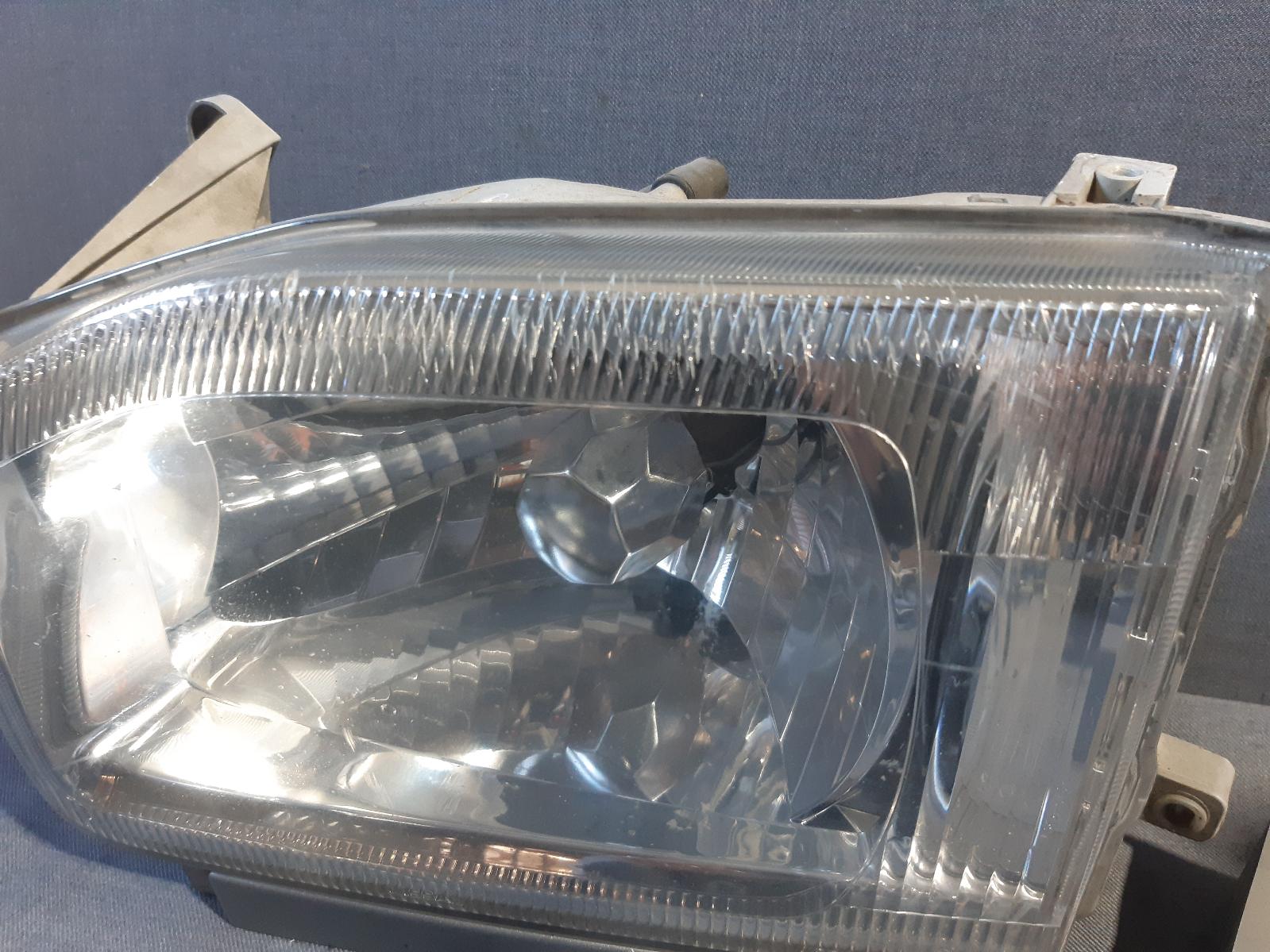 1999 NISSAN PATHFINDER Left Headlamp Contact us for Photo